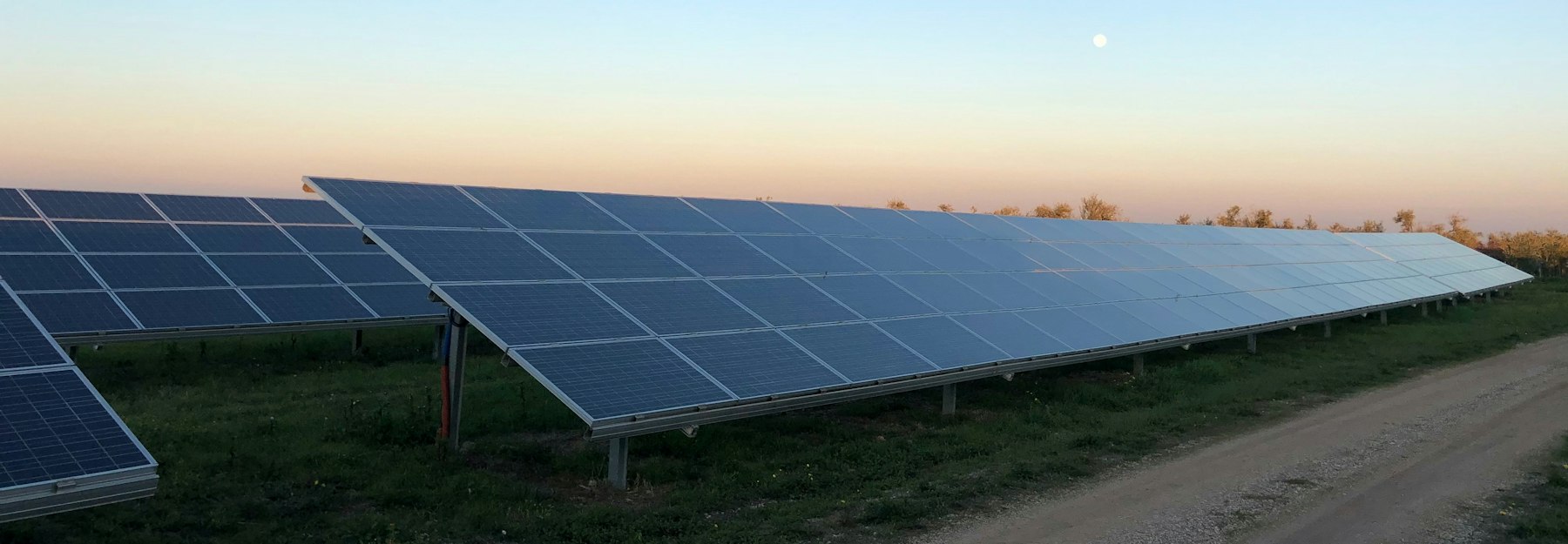 Rows of solar panels at a community solar project