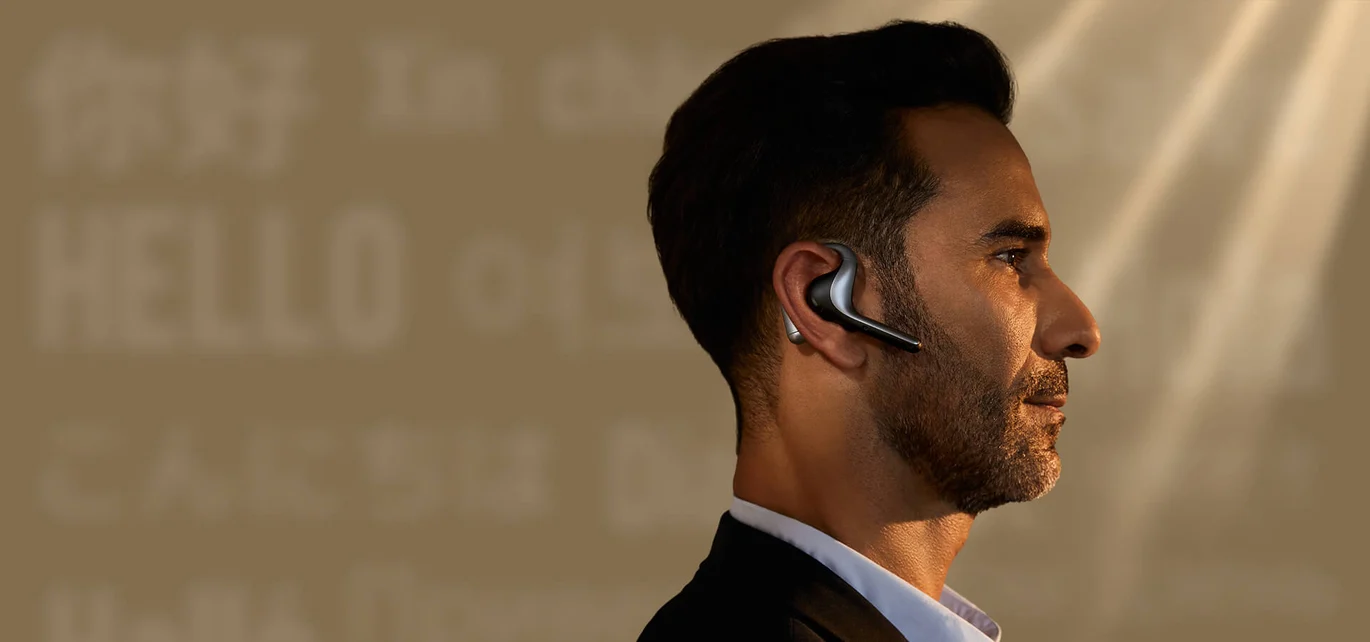 Professional wearing the Timekettle W4 Pro interpreter earbud